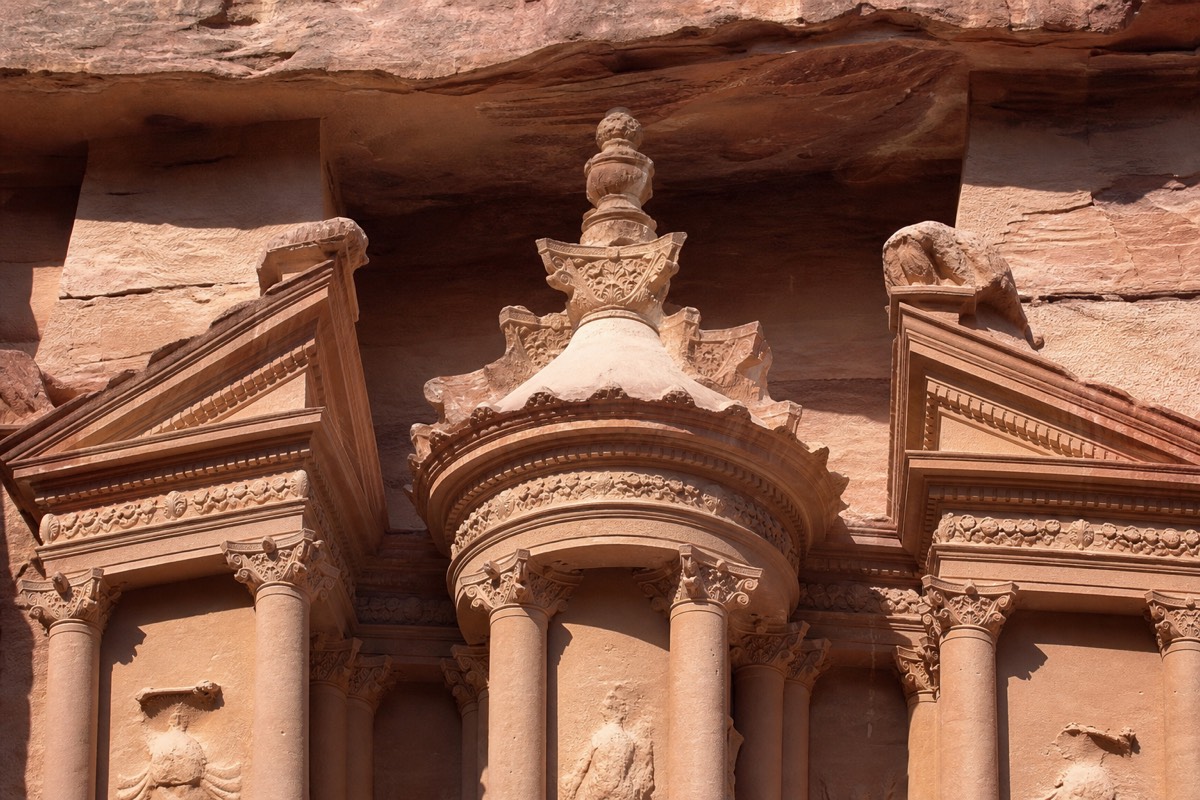 The Treasury (Al-Khazneh) carved into the rose-red cliff at Petra